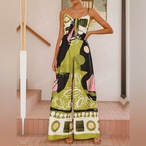 Bright flowy jumpsuit, with front tie detail size XL